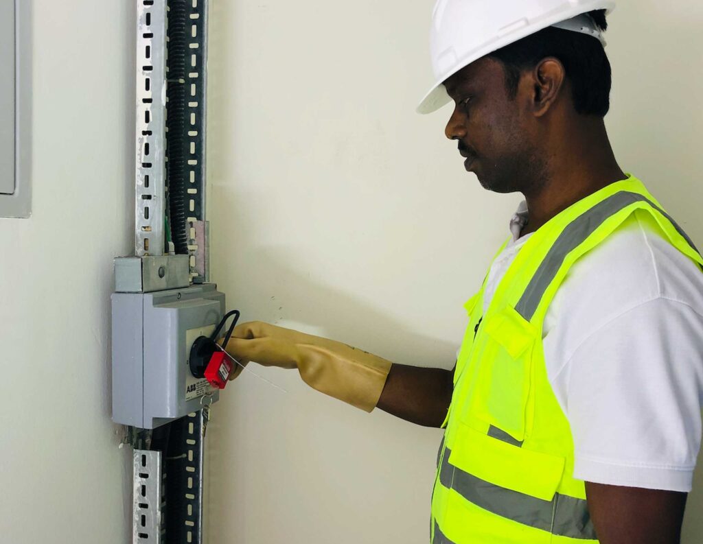 DCX Data Center team doing lockout for electrical isolator before starting the project
