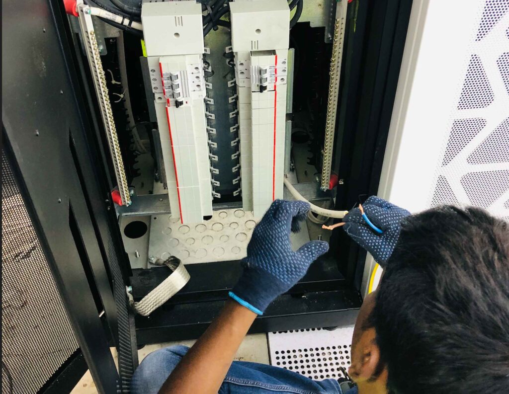 DCX Power Team installing 3P UPS Bypass Panel